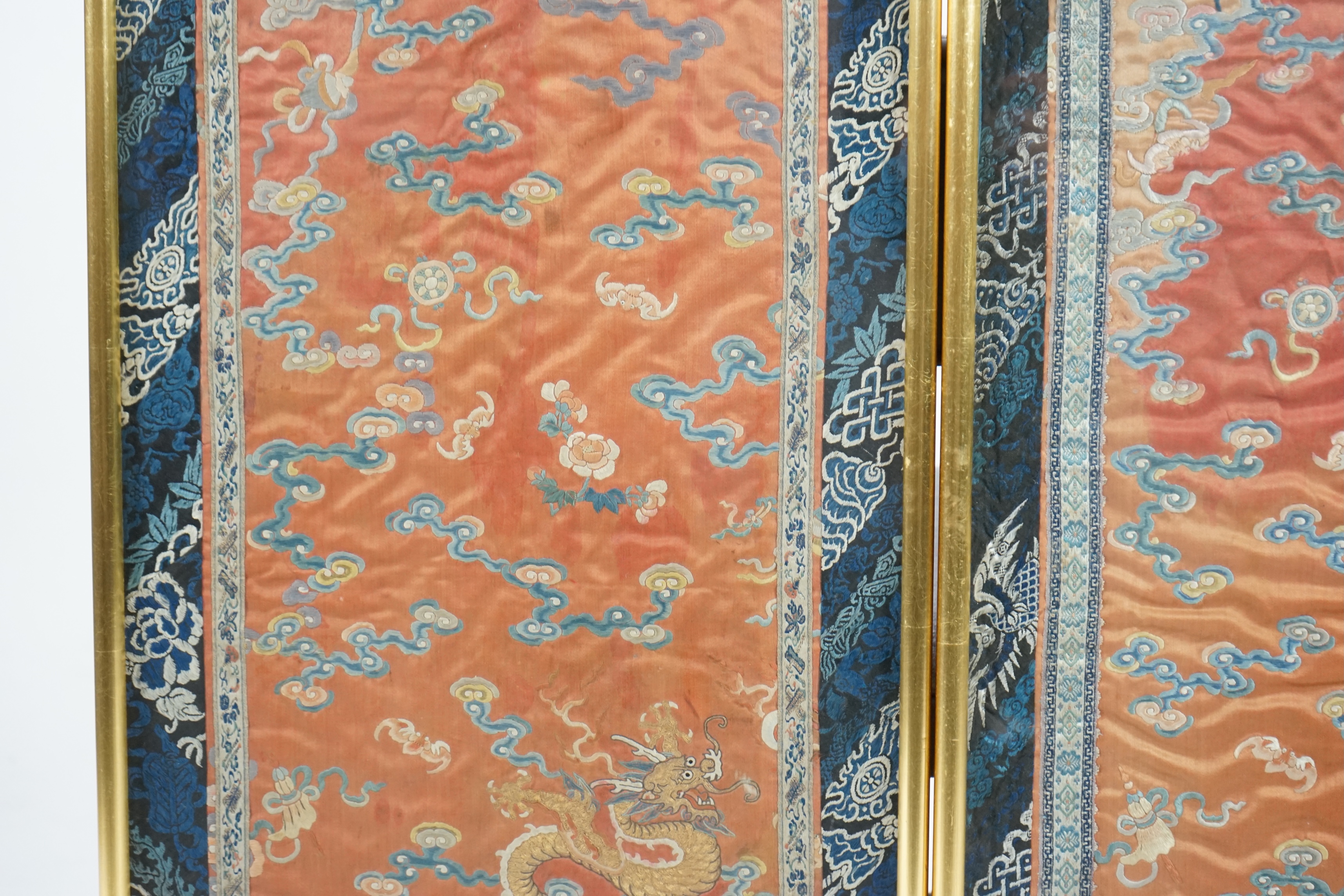 A pair of Chinese coral silk ‘dragon’ panels, 19th century